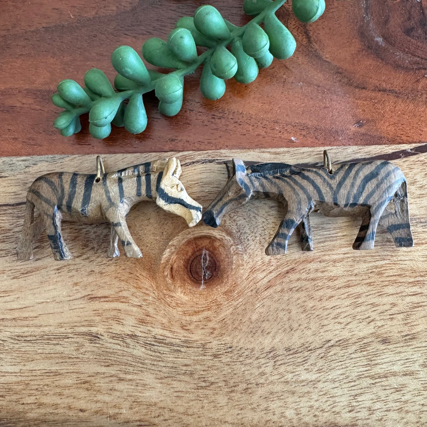 Pair of Vintage Carved African Zebra Pendants
