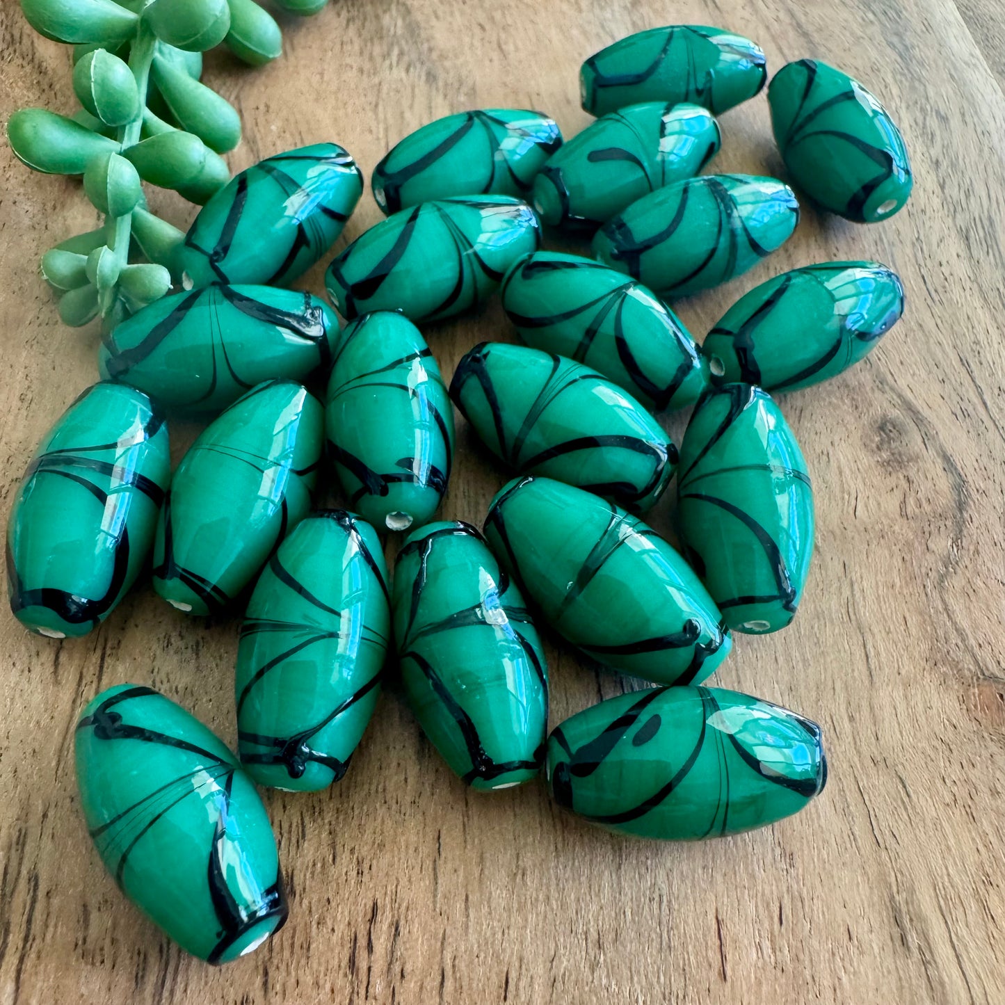 Green & Black Swirled Glass Beads | 20 Pieces - 12x24mm (India)