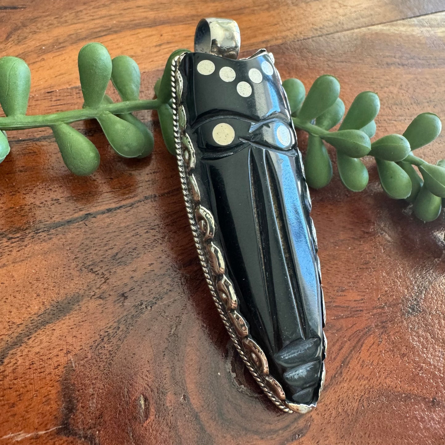 Carved Horn Face Pendant with Embossed Silver Tone Metal