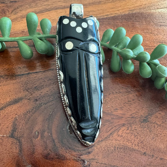 Carved Horn Face Pendant with Embossed Silver Tone Metal