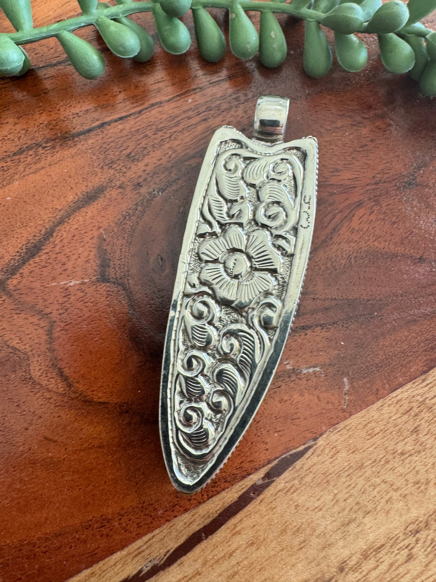 Carved Horn Face Pendant with Embossed Silver Tone Metal