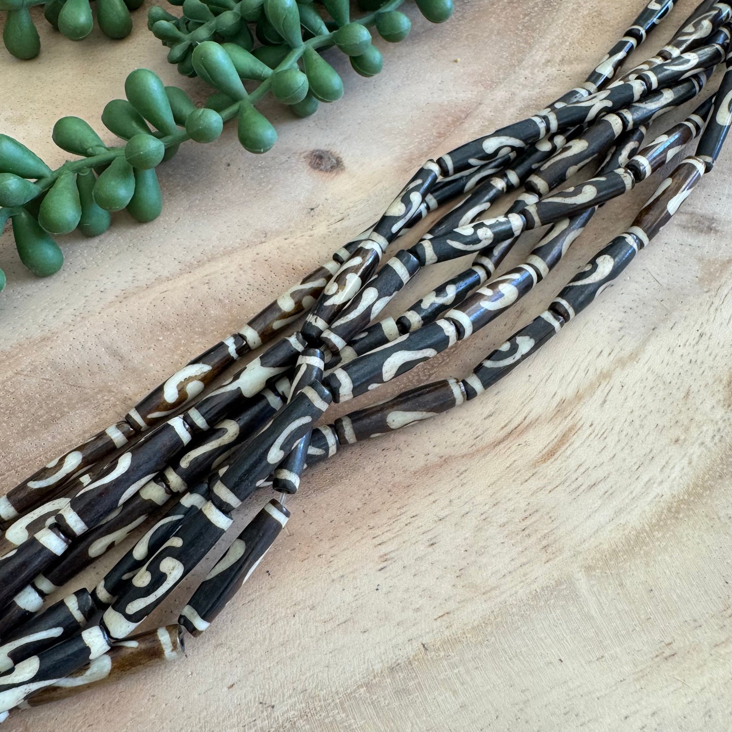 Adinkra Batik Bone Tube Beads – 6x24 mm – 15–16 Inch Strand BN23