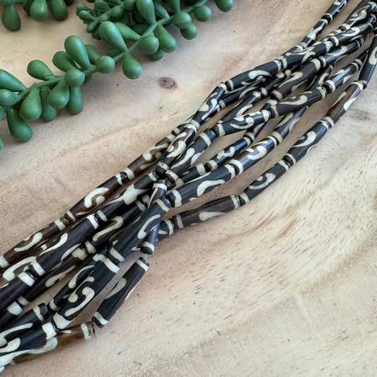 Adinkra Batik Bone Tube Beads – 6x24 mm – 15–16 Inch Strand BN23